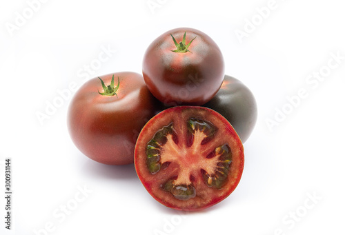 Kumato tomatoes on a white background