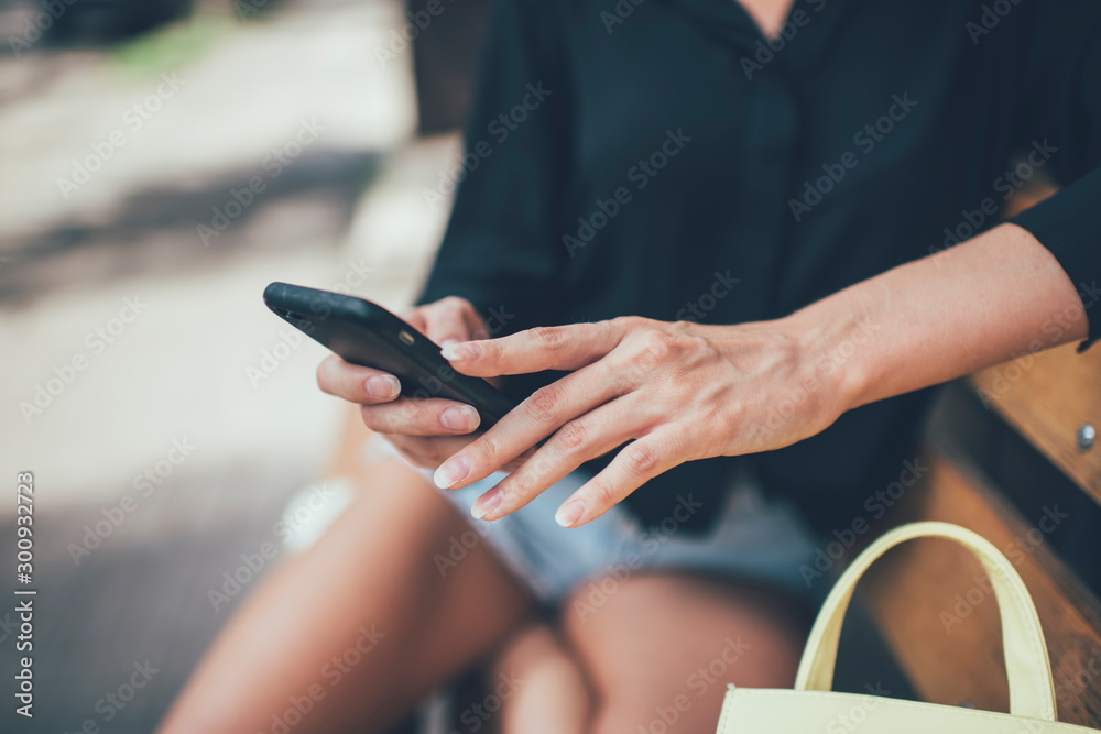 Selective focus on female hands typing text sms for sending using 4g wireless for browsing website on smartphone gadget, woman searching information about notification for cellphone device