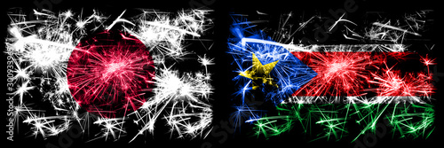 Japan, Japanese vs South Sudan New Year celebration sparkling fireworks flags concept background. Combination of two abstract states flags © Vlad