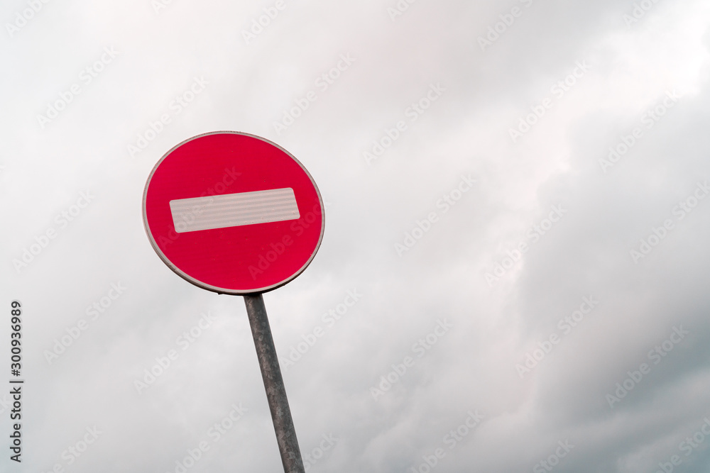 No entry sign in front of cloudy sky No entry sign in front of cloudy sky