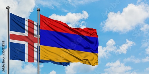 Iceland and Armenia flag waving in the wind against white cloudy blue sky together. Diplomacy concept  international relations.