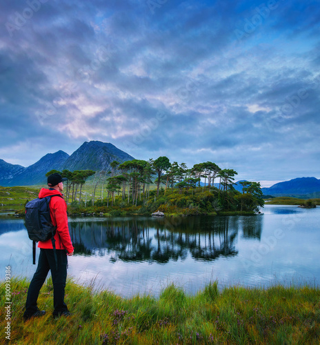 Young hiker at the Pine Island in Derryclare Lough