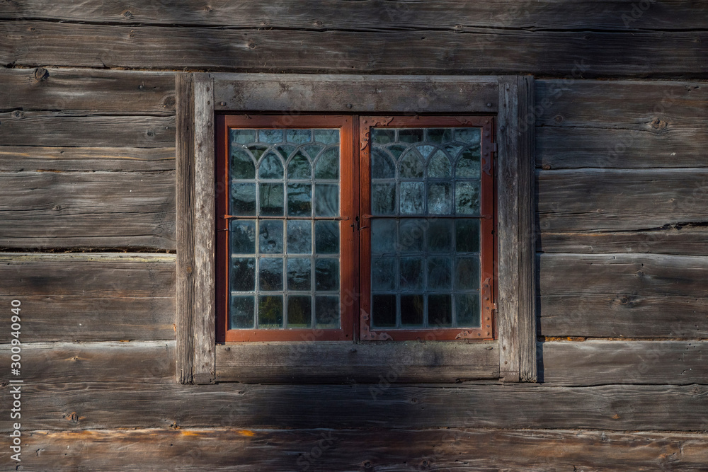 Window in a old wooden house in Stockholm Window in a old wooden house in Stockholm