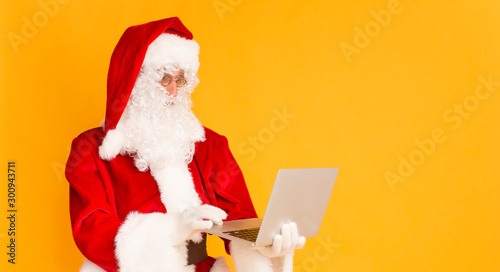 Santa Claus chatting about Christmas wishes with children