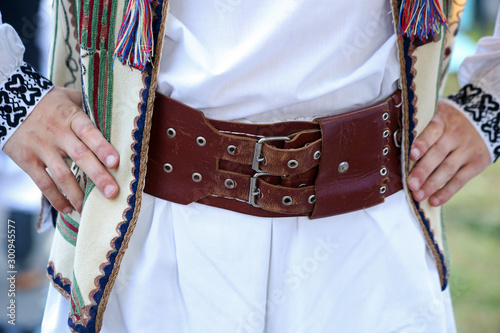 Details of men traditional Romanian folklore costume with rich emroidery. photo