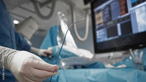 Surgeon uses navigation catheter of medical robotic magnetic system. Close-up photo