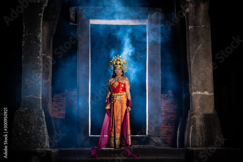 Portrait of asian woman wear ancient thai dress style and makeup ghost face at the old castles at night scene,Thailand people
