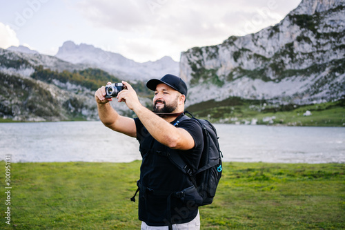 A man take photos in a mountain landscape