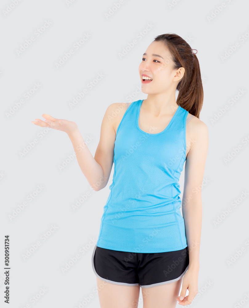 Beautiful portrait young asian woman in sport with satisfied and holding and throw green apple isolated on white background, girl asia have shape and wellness, exercise for fit with health concept. Beautiful portrait young asian woman in sport with satisfied and holding and throw green apple isolated on white background, girl asia have shape and wellness, exercise for fit with health concept.