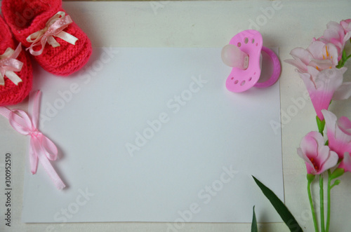 Baby girl knitted sandal, booties, shoes baby newborn, blank postcard. cocept it s a girl or baby shouer photo