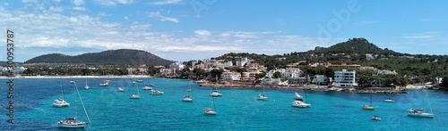 Panoramic image coastline of Santa Ponsa town in the south-west of Majorca Island. Located in the municipality of Calvia, moored yachts on the turquoise tranquil bay of Mediterranean Sea, Spain