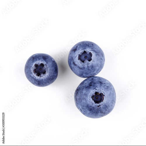 Three blueberries isolated on white with clipping path. Top view