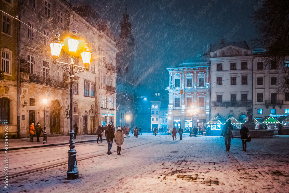 Lviv street in winter - obrazy, fototapety, plakaty 