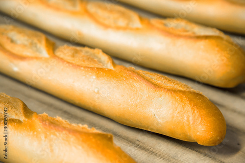 crunchy french breads arranged rolling mill mat in a bakery