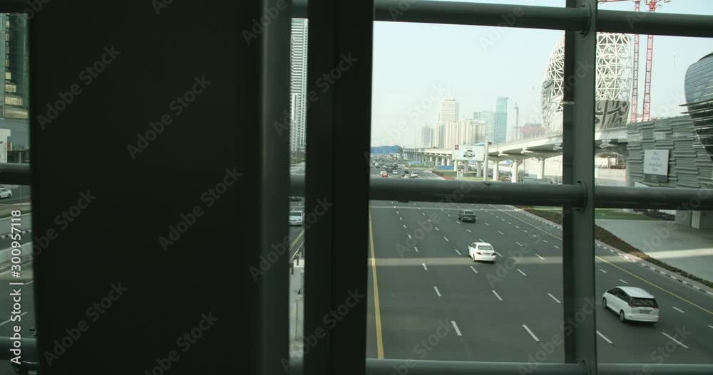 Cars driving in the city center of Dubai during the day Cars driving in the city center of Dubai during the day