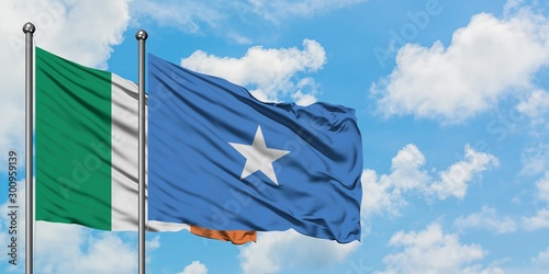 Ireland and Somalia flag waving in the wind against white cloudy blue sky together. Diplomacy concept, international relations.