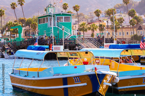Colorful water taxi boats sit moored near the famous Green Pier at Avalon, on Catalina Island photo