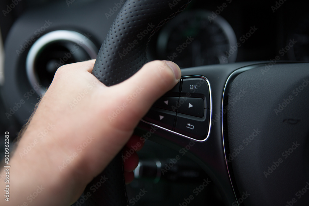 hand of man driving a car