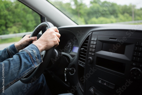 hand of man driving a car