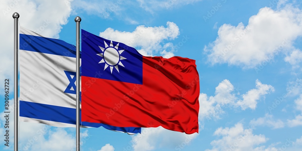 Israel and Taiwan flag waving in the wind against white cloudy blue sky together. Diplomacy concept, international relations. Israel and Taiwan flag waving in the wind against white cloudy blue sky together. Diplomacy concept, international relations.
