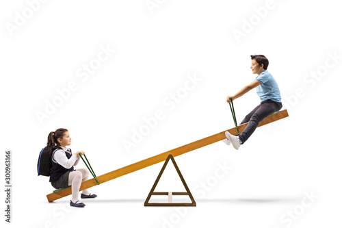 Foto Happy kids playing on a seesaw