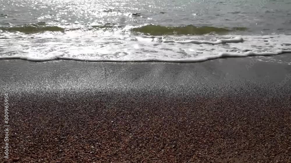 stunning sunset in a tropical beach in Thailand island, close up of sand and waves stunning sunset in a tropical beach in Thailand island, close up of sand and waves