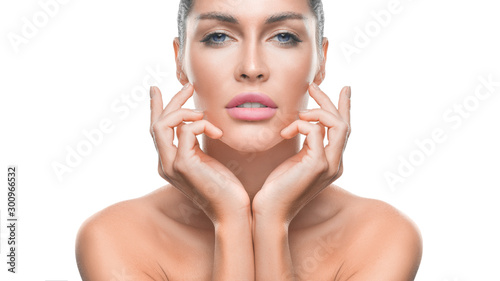 Woman with perfect skin touching her face.