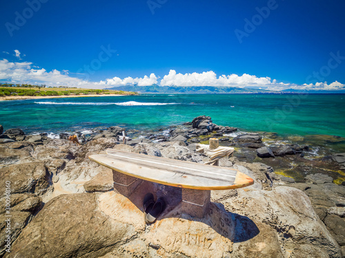 Ho'okipa Beach Park in Maui Hawaii, renowned windsurfing and surf site for wind, big waves and big Turtles drying on sand. Snorkeling paradise for coral reefs. photo