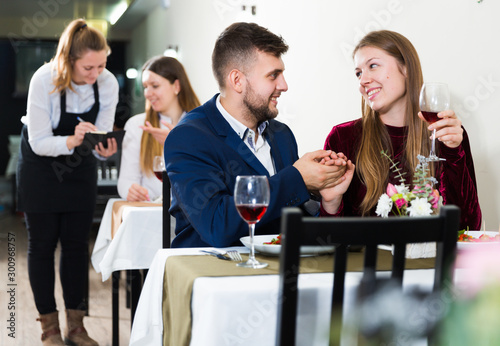 Romantic couple is having dinner in the restaurante