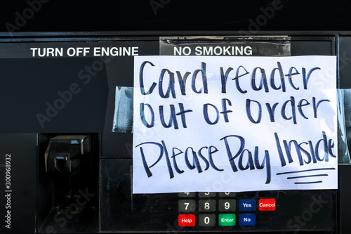 Frustration at the Gas Station - Handmade sign taped on gasoline pump - Card reader out of order Please Pay inside