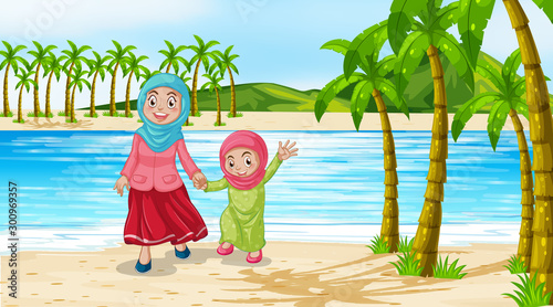 Mother and daughter by the ocean