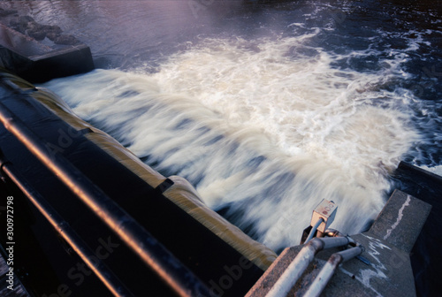 A Small Dam Releases Water from a Lake