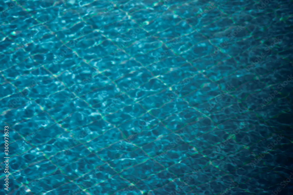 A blue water background. Pool or sea surface texture