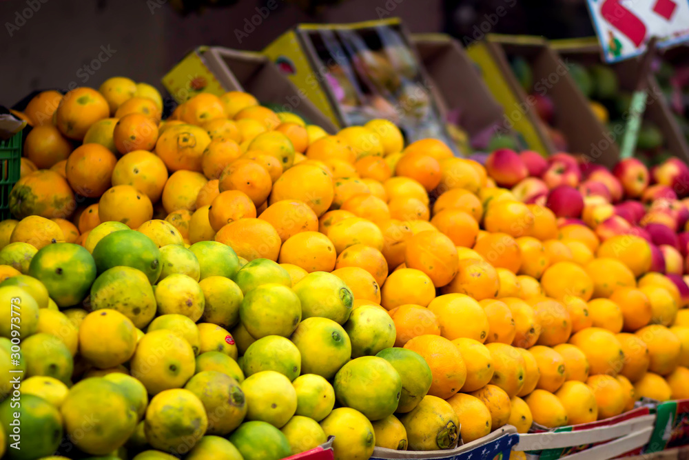 Fresh limes and oranges at the fruit and vegetable market