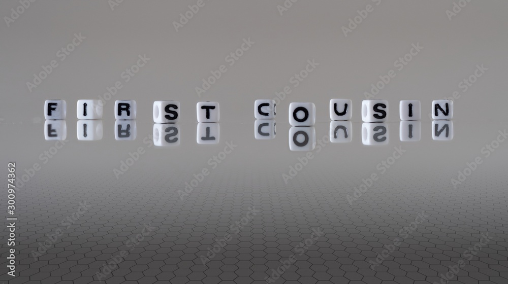 The concept of first cousin represented by wooden letter tiles The concept of first cousin represented by wooden letter tiles