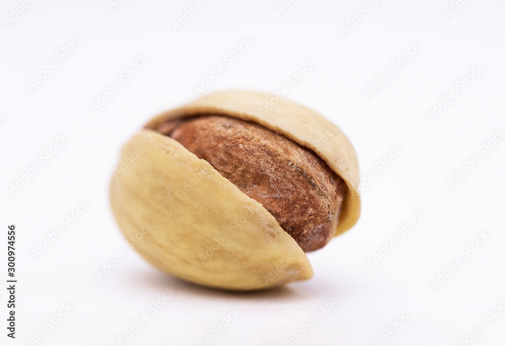 pistachio on a white background. dried nut close up pistachio on a white background. dried nut close up
