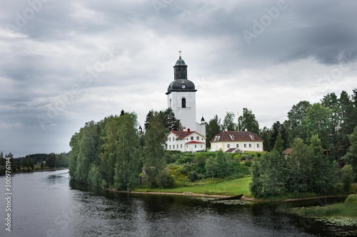 An old church lying next to a river in northern sweden