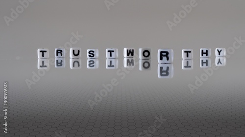 The concept of trustworthy represented by wooden letter tiles