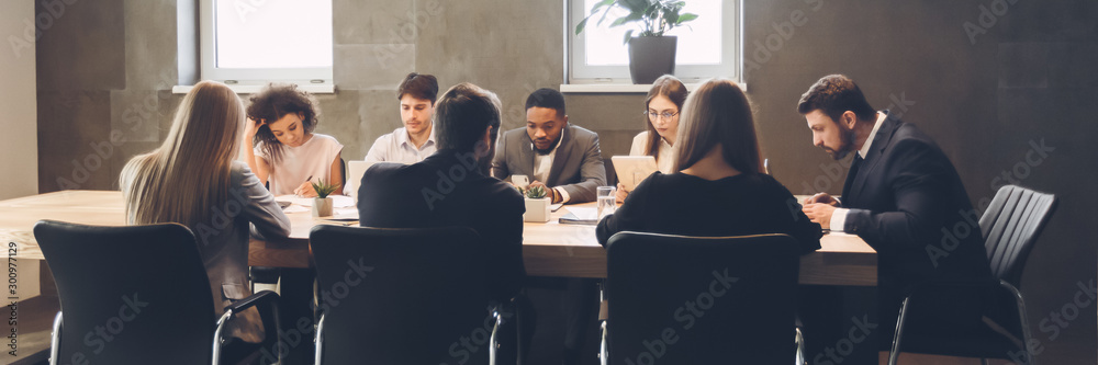 Colleagues having meeting and discussion in boardroom - obrazy, fototapety, plakaty 