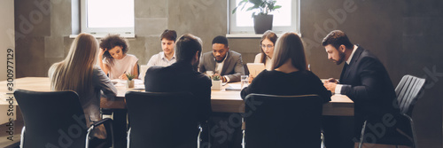Obraz na płótnie Colleagues having meeting and discussion in boardroom