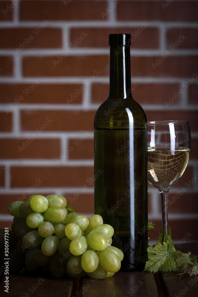 White wine bottle and brick background