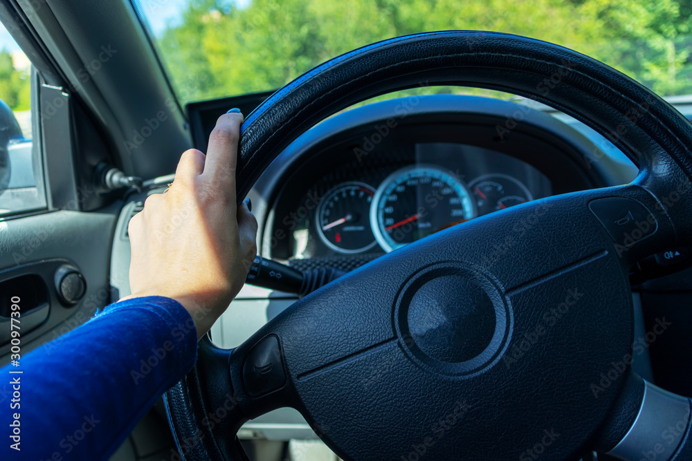 Close-up Of Woman's Hand Holding Steering Wheel