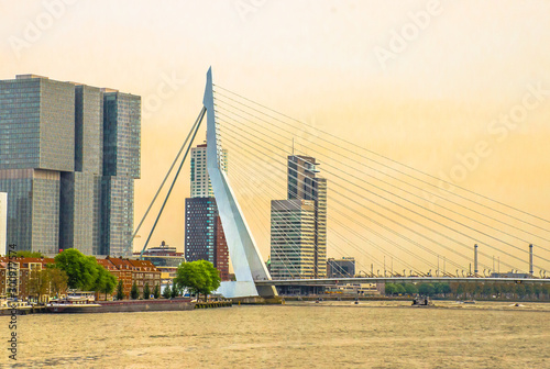 Rotterdam Erasmus bridge on sunset time. Other Rotterdam skyscrapers are in the background.