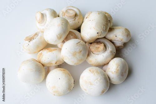 Champignons are on a light surface.