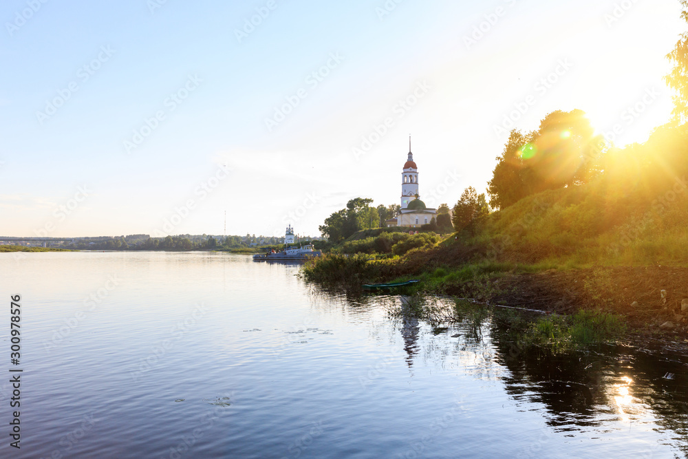 Russian Church of the Resurrection against the blue sky, Totma, Russia. Sunset on the banks of the Sukhona river in the city of Totma