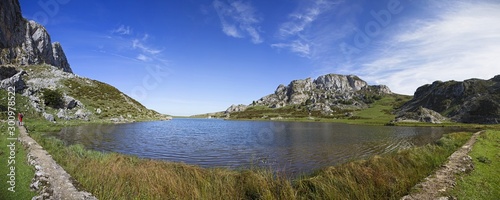Panoramic flush with the water of the lakes of Covadonga, Asturias. Vertical photo