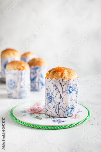 Homemade Easter cakes in paper wrapper. Light background