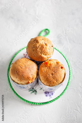Homemade Easter cakes in paper wrapper. Light background