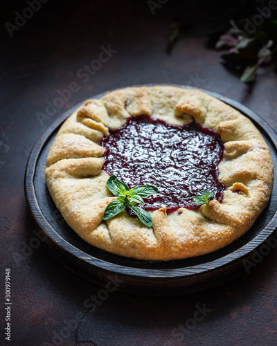 Homemade open cake made of red currant shortcrust pastry, gallette