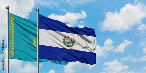 Kazakhstan and El Salvador flag waving in the wind against white cloudy blue sky together. Diplomacy concept, international relations.